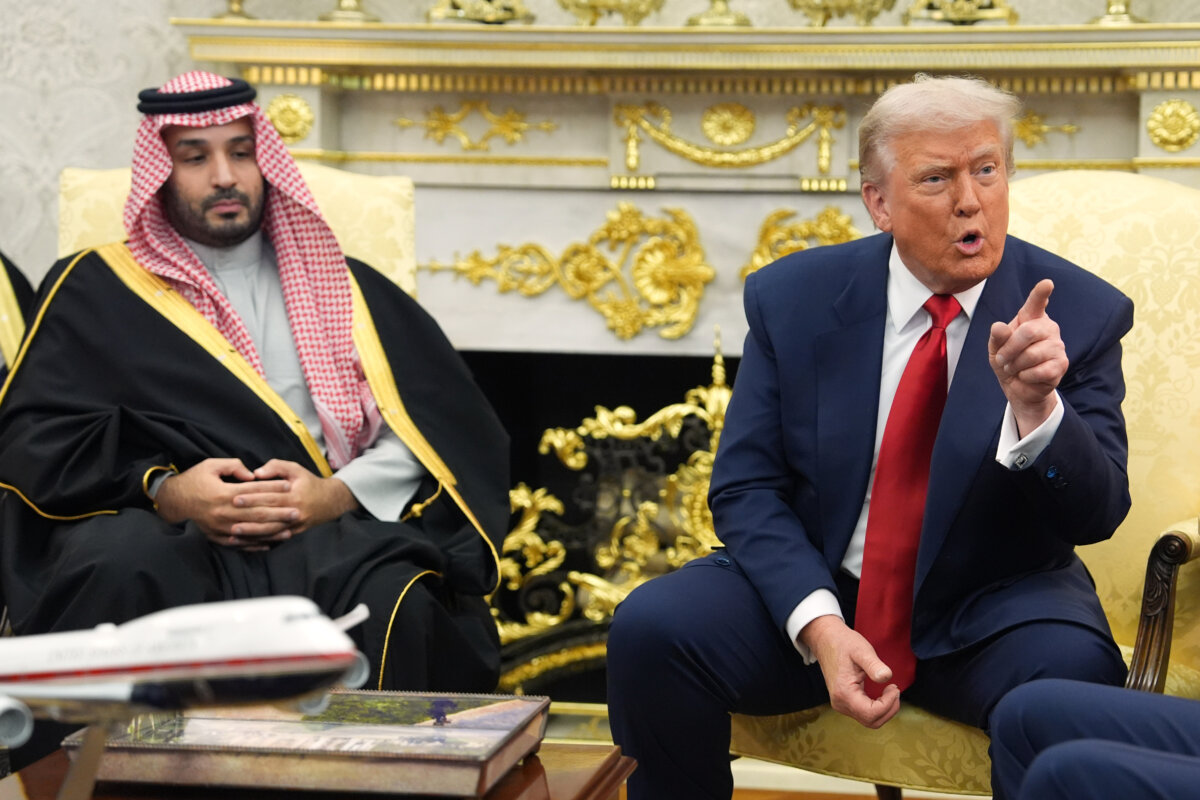 President Donald Trump points to a reporter as he meets Saudi Arabia's Crown Prince Mohammed bin Salman in the Oval Office of the White House, on Nov. 18, 2025. (Evan Vucci/AP Photo)