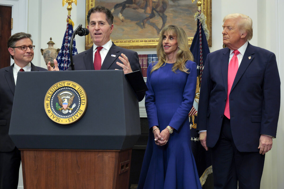 Tech billionaire Michael Dell speaks as (L–R) Speaker of the House Mike Johnson (R-La.), Susan Dell and President Donald Trump look on while making an announcement about "Trump accounts" in the Roosevelt Room at the White House on Dec. 2, 2025. (Chip Somodevilla/Getty Images)