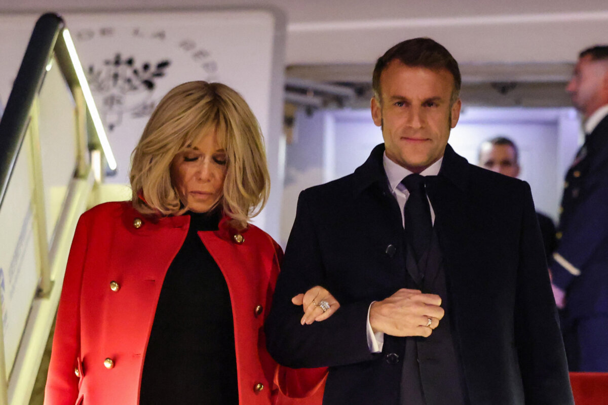 France's President Emmanuel Macron and his wife Brigitte Macron disembark from their plane upon their arrival at the Capital International Airport in Beijing on Dec. 3, 2025. (Ludovic Marin-Pool/Getty Images)