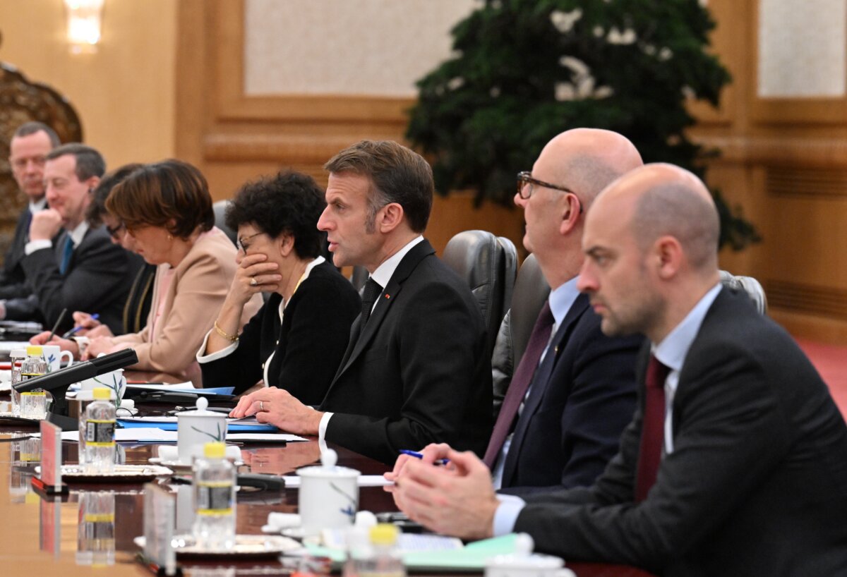 French President Emmanuel Macron speaks to Chinese leader Xi Jinping (unseen) during a meeting in Beijing on Dec. 4, 2025. (Adek Berry/Pool/Getty Images)
