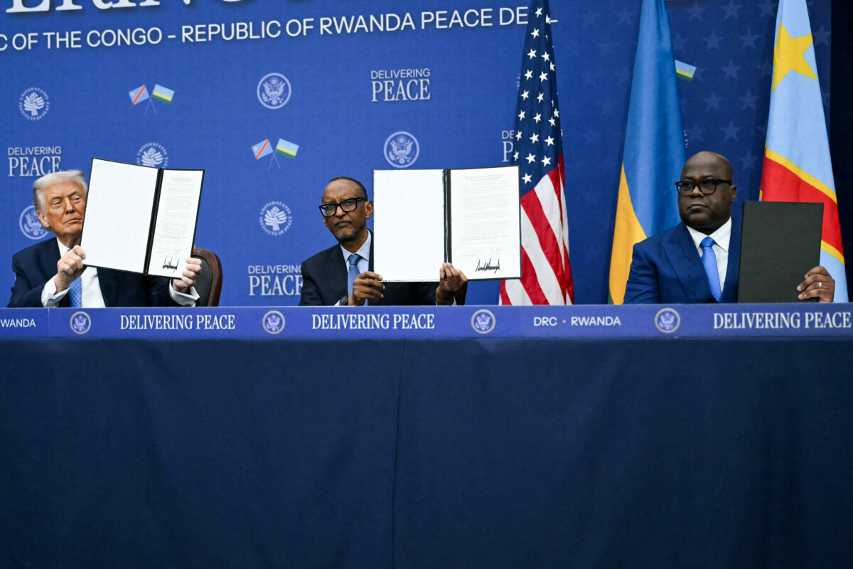 (L–R) U.S. President Donald Trump participates in the signing ceremony for a peace deal with Rwandan President Paul Kagame and Congolese President Felix Tshisekedi at the Donald J. Trump Institute of Peace in Washington on Dec. 4, 2025. (Andrew Caballero-Reynolds/AFP via Getty Images)