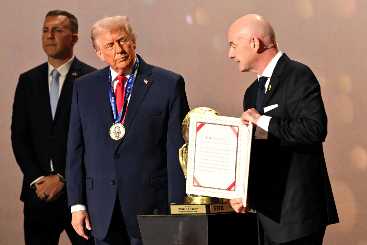 President Donald Trump receives the FIFA Peace Prize from Gianni Infantino, president of FIFA, during the FIFA World Cup 2026 Official Draw at John F. Kennedy Center for the Performing Arts on Dec. 5, 2025. (Mandel Ngan/Pool/Getty Images)