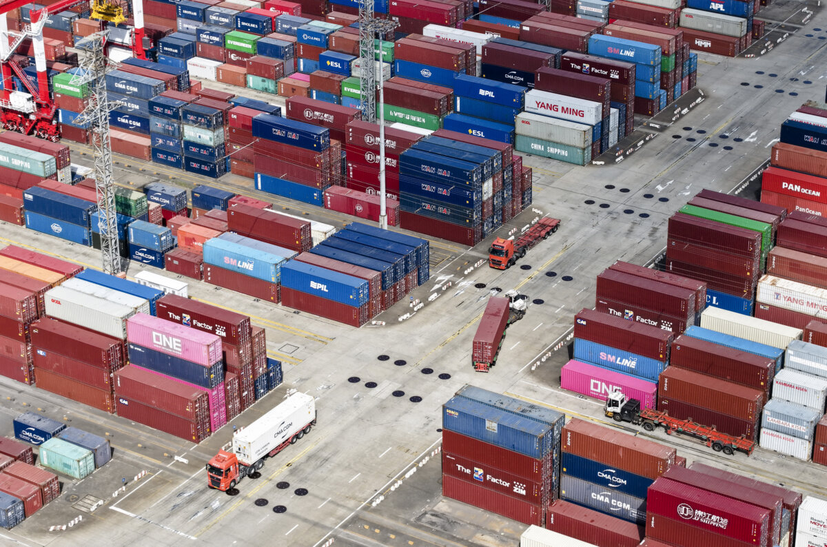 Trucks operating at the Shanghai Port container terminal in Shanghai on Dec. 8, 2025. (Photo by AFP via Getty Images) / China OUT