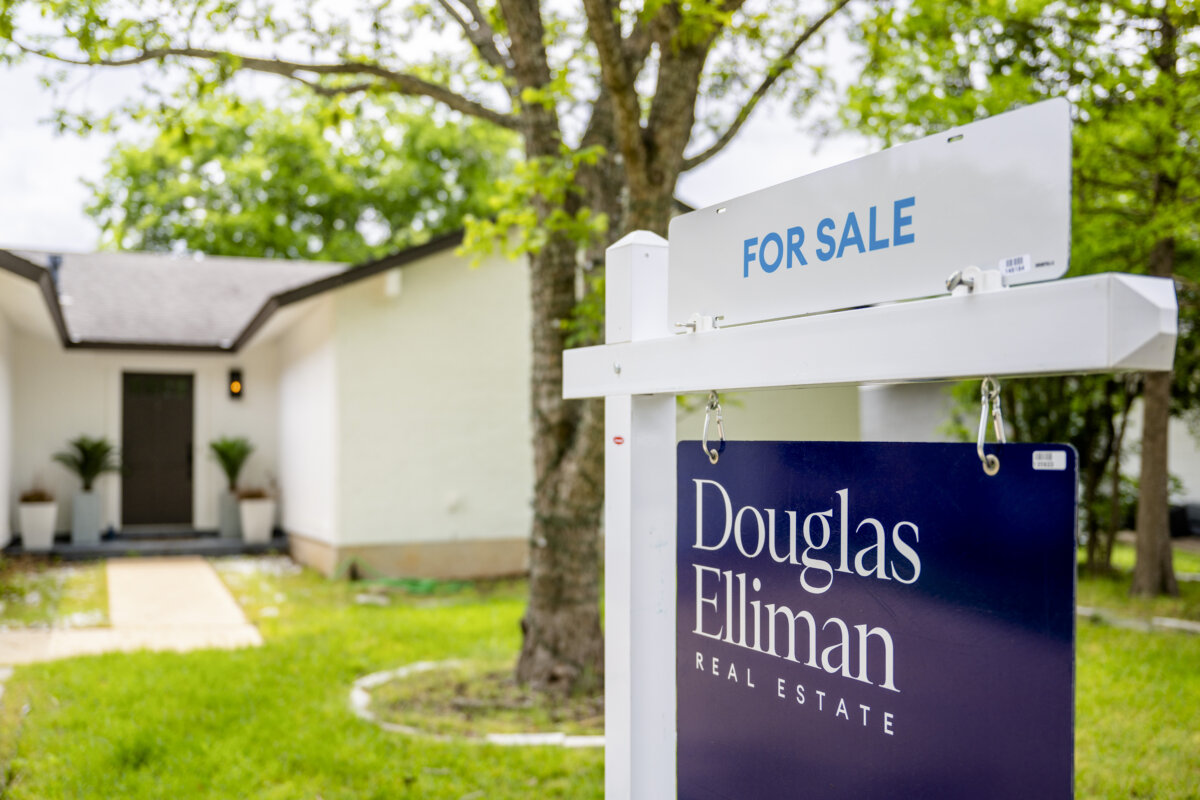 A for sale sign near a home in Austin, Texas. (Brandon Bell/Getty Images)