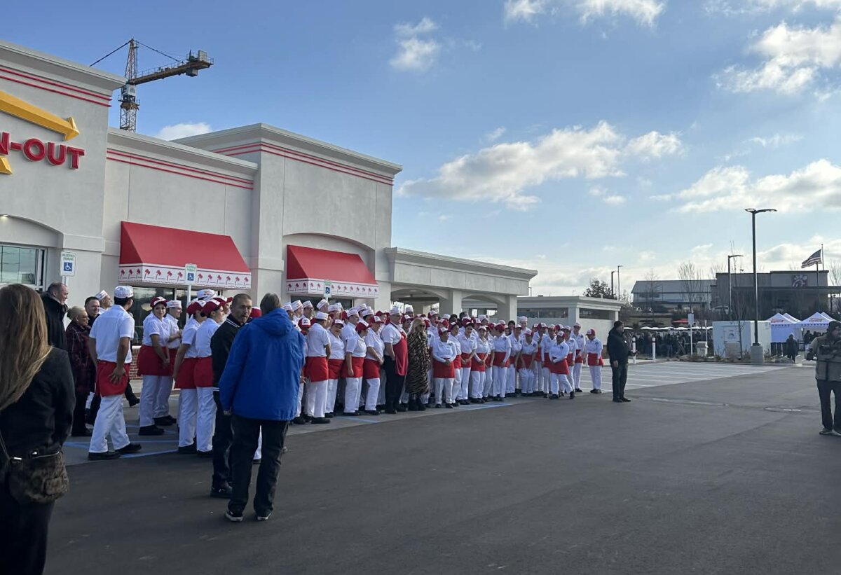 Snyder and employees stood outside of the Antioch restaurant before opening on Dec. 10. (Mat Graves / The Epoch Times)