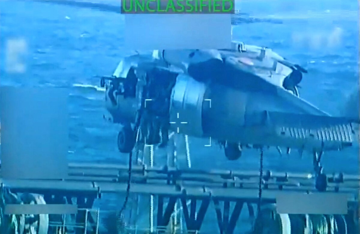 U.S. forces abseil onto an oil tanker during a raid described by U.S. Attorney General Pam Bondi as its seizure by the United States off the coast of Venezuela, on Dec. 10, 2025. (U.S. Attorney General/Handout via Reuters).
