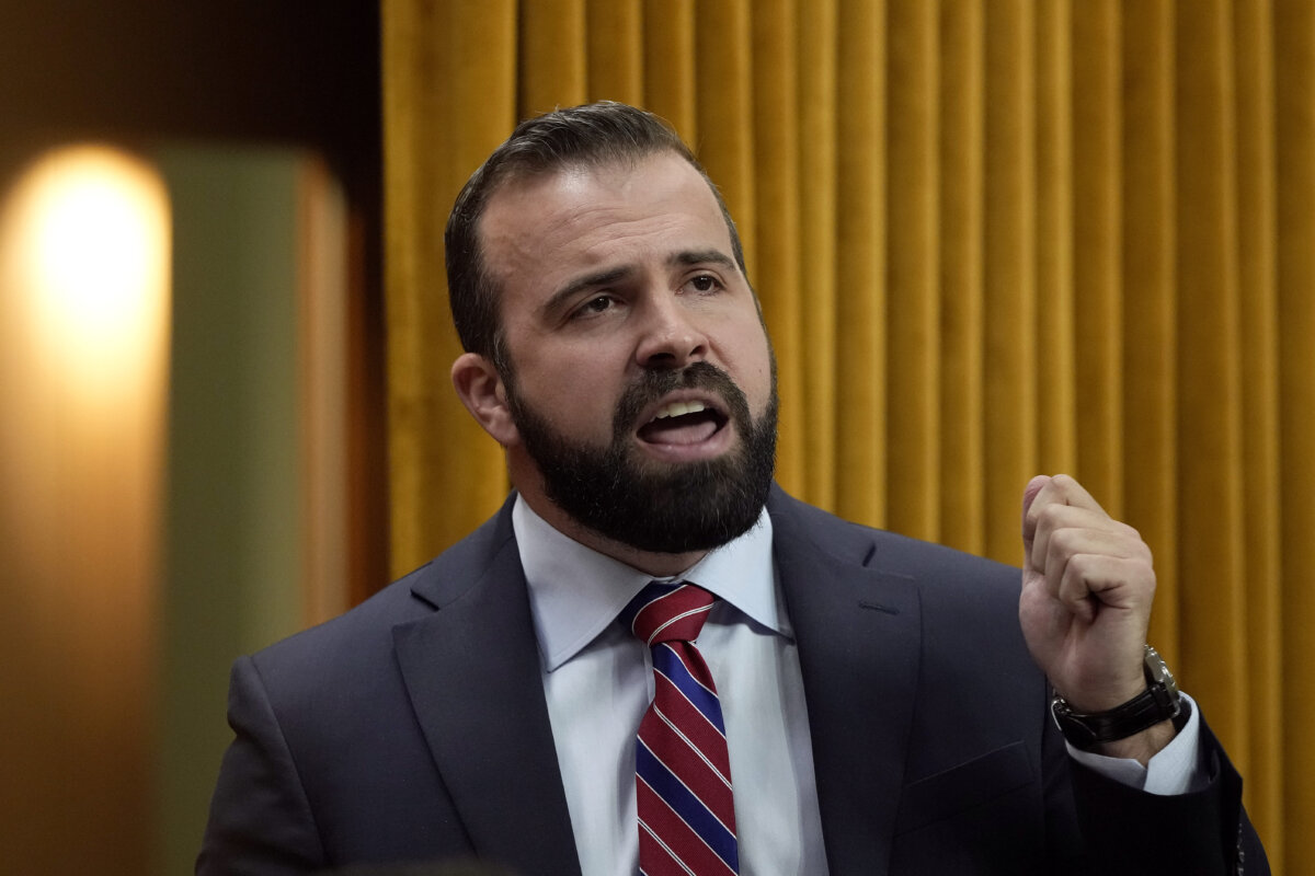 MP for North Island-Powell River Aaron Gunn rises during question period on Parliament Hill in Ottawa on Nov. 26, 2025. (The Canadian Press/Adrian Wyld)