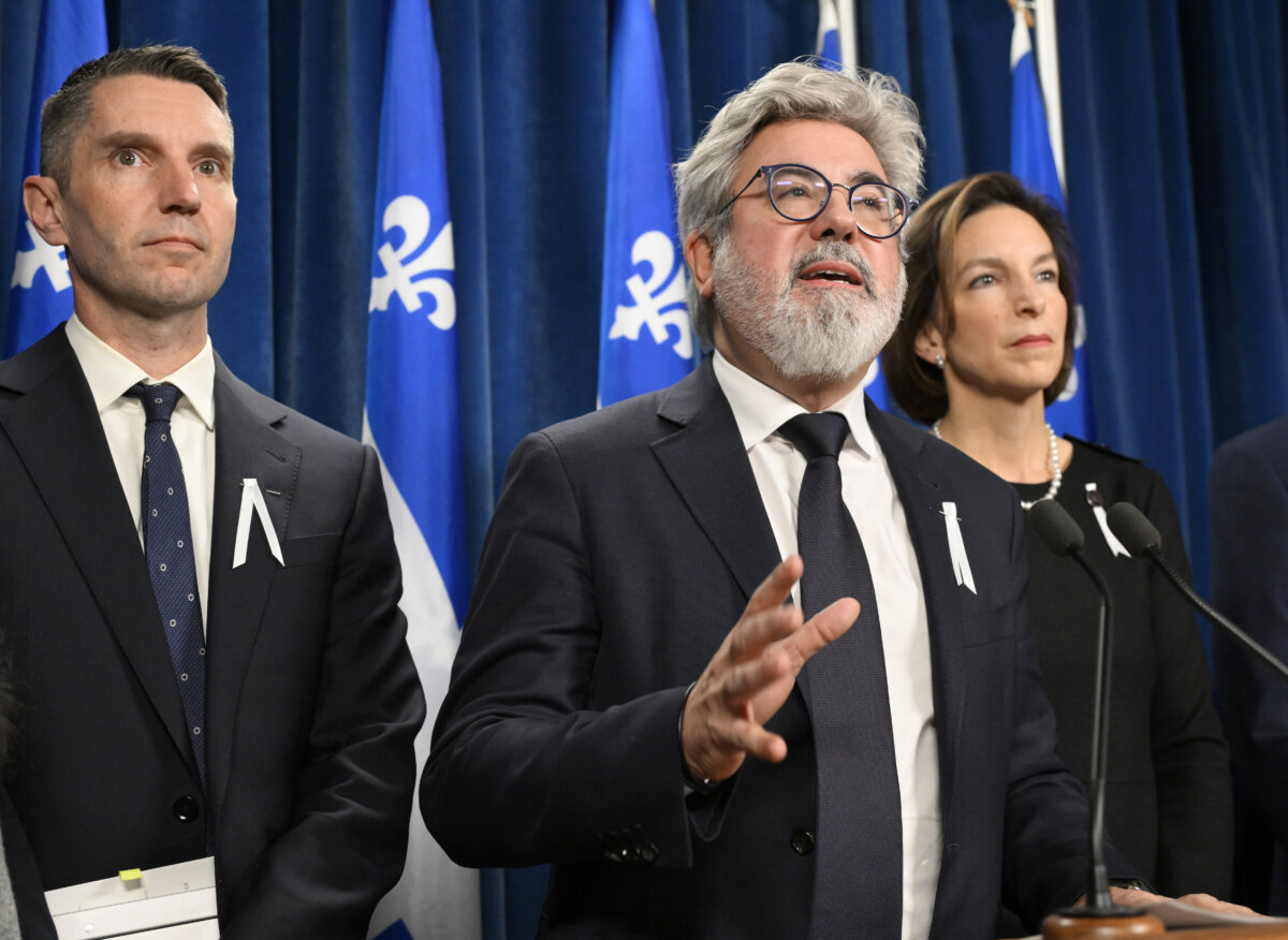 Quebec Liberal Leader Pablo Rodriguez speaks at a news conference at the legislature. Liberal member, André Fortin (L), and legislature leader Michelle Setlakwe (R), look on in Quebec City, on Dec. 2, 2025. (The Canadian Press/Jacques Boissinot)