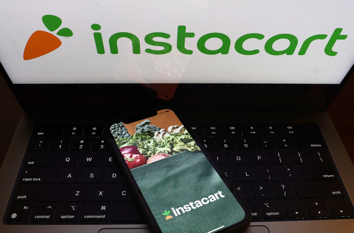 A photo illustration of the Instacart logo. (Justin Sullivan/Getty Images)