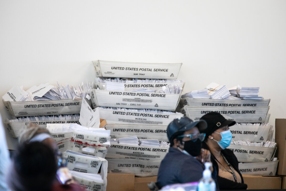 Security envelopes for absentee ballots sit in stacked boxes as Fulton county workers continue to count absentee ballots at State Farm Arena in Atlanta on Nov. 6, 2020. (Jessica McGowan/Getty Images)