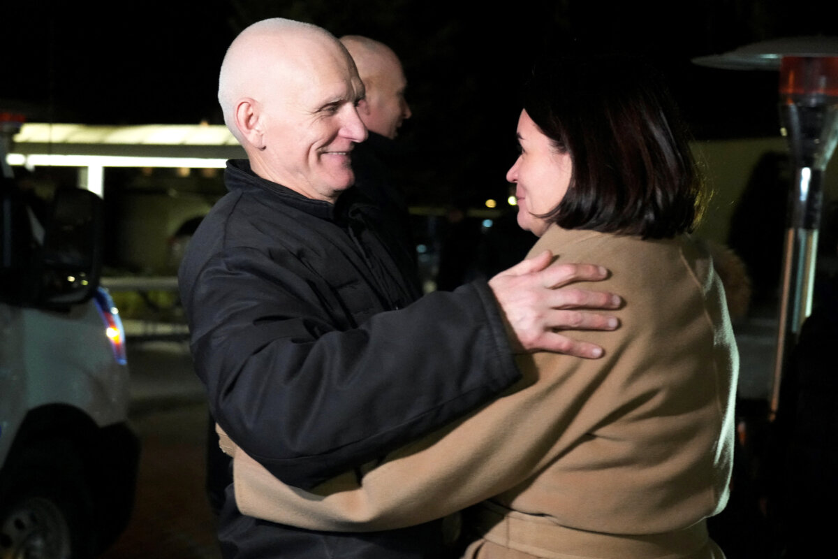 Belarusian opposition leader Sviatlana Tsikhanouskaya welcomes Ales Bialatski, prisoner released from Belarus, as he arrives at the U.S. embassy in Vilnius, Lithuania, on Dec. 13, 2025. (Ints Kalnins/Reuters)