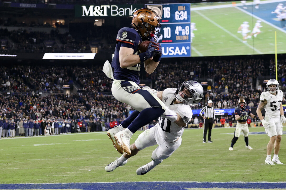 Navy running back Eli Heidenreich catches a touchdown pass during the second half of an NCAA college football game against Army in Baltimore, Md., on Dec. 13, 2025. (Daniel Kucin Jr./AP Photo)