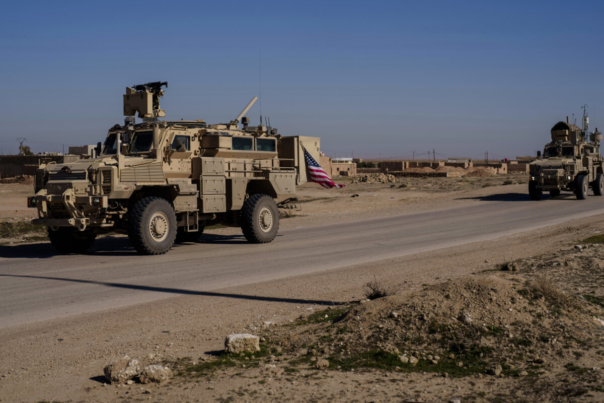 A U.S. military convoy drives along a road in northeastern Syria's Hasakah Province on Jan. 30, 2025. (Bernat Armangue/AP Photo)