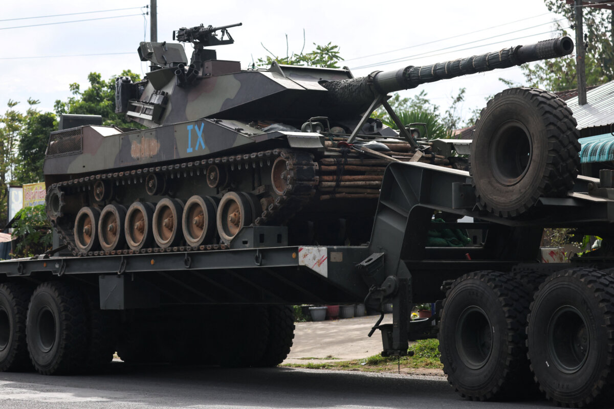 A military truck carries a tank on a road amid deadly clashes between Thailand and Cambodia along a disputed border area, in Surin province, Thailand, on Dec. 11, 2025. (Athit Perawongmetha/Reuters)