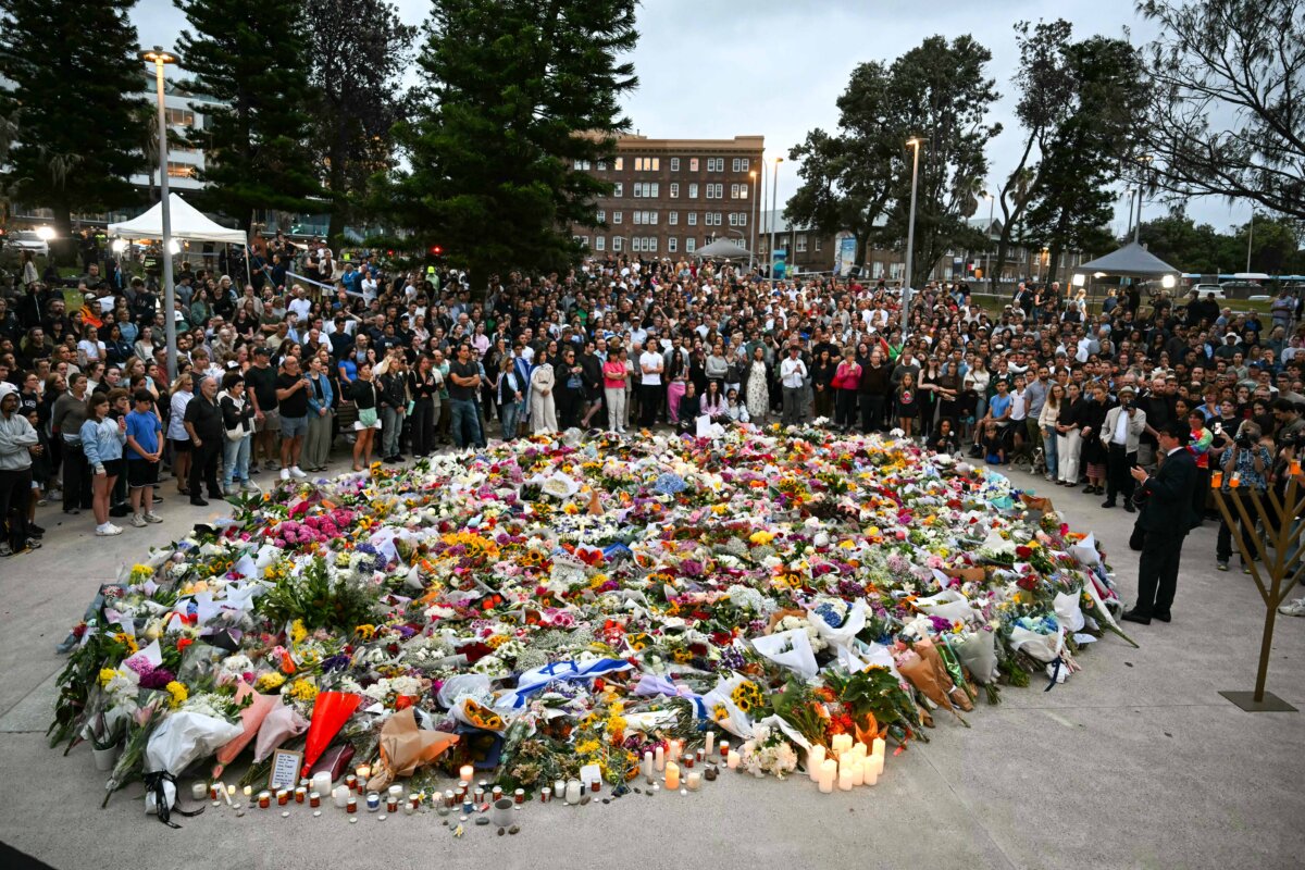 Mourners gather at the Bondi Pavilion in memory of the shooting victims at Bondi Beach in Sydney, on Dec. 15, 2025. A father and son opened fire on a Jewish festival at the Australian beach, leaving 15 people dead, including a child, authorities said. (Saeed Khan/AFP via Getty Images)