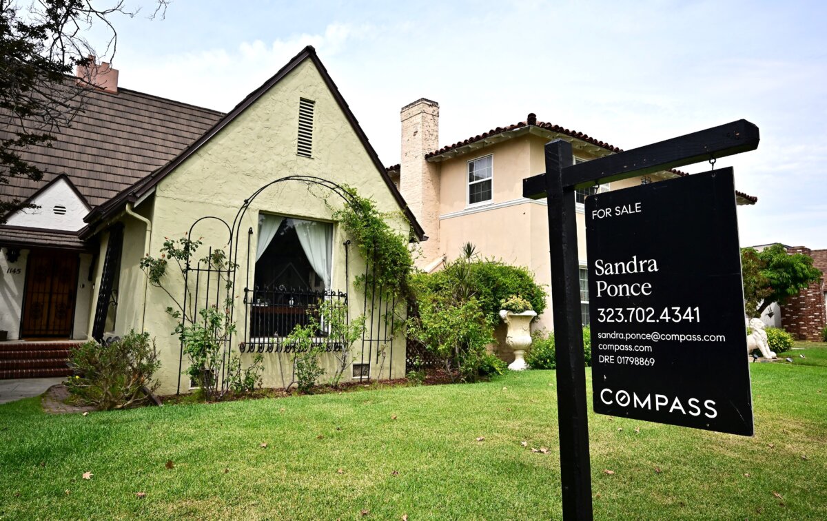 A "For Sale" sign is posted beside property for sale in Alhambra, Calif., on Aug. 28, 2025. (Frederic J. Brown/AFP via Getty Images)