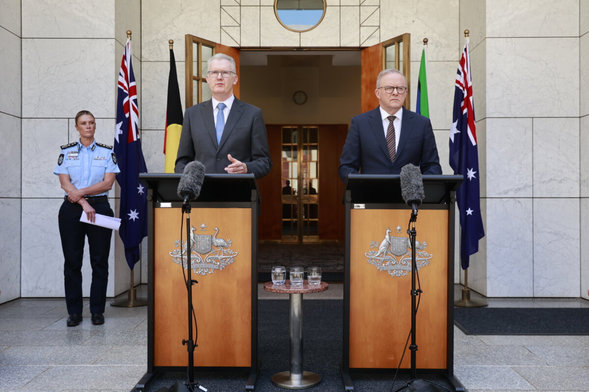 Home Affairs Minister Tony Burke (L) and Australian Prime Minister Anthony Albanese (R) speak to the media at Parliament House in Canberra, Australia, on Dec. 19, 2025. (Hilary Wardhaugh/Getty Images)