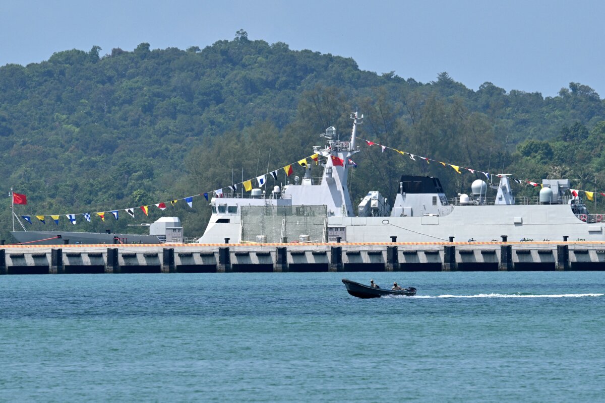 Cambodian soldiers travel on a speedboat near a Chinese warship docked at the Ream Naval Base in Preah Sihanouk province, Cambodia, on April 5, 2025. (Tang Chhin Sothy/AFP via Getty Images)
