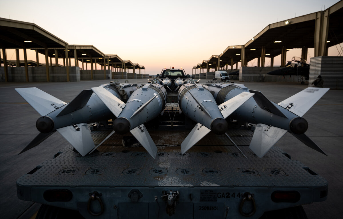U.S. Airmen prepare to load GBU-31 munitions onto F-15E Strike Eagles in support of Operation Hawkeye Strike, on Dec. 18, 2025. (U.S. Air Force)