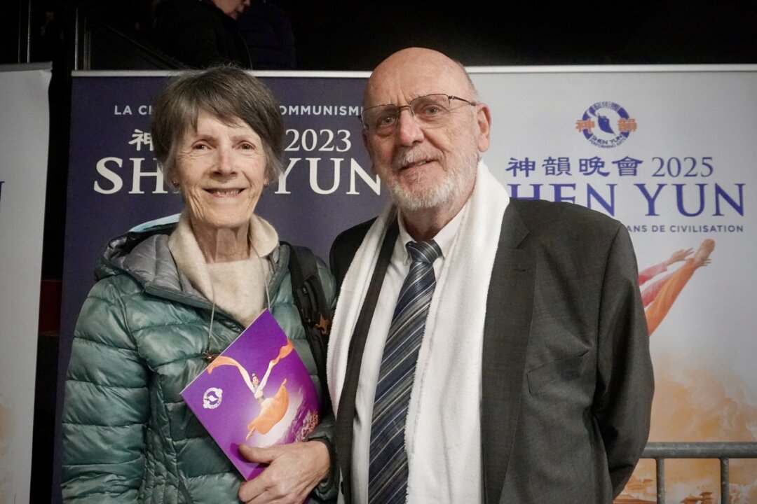 Dr. Jean-Pierre Eudier (R) enjoyed Shen Yun's matinee at Galaxie Amnéville, in France, on Dec. 19, 2025. (Mary Man/The Epoch Times)