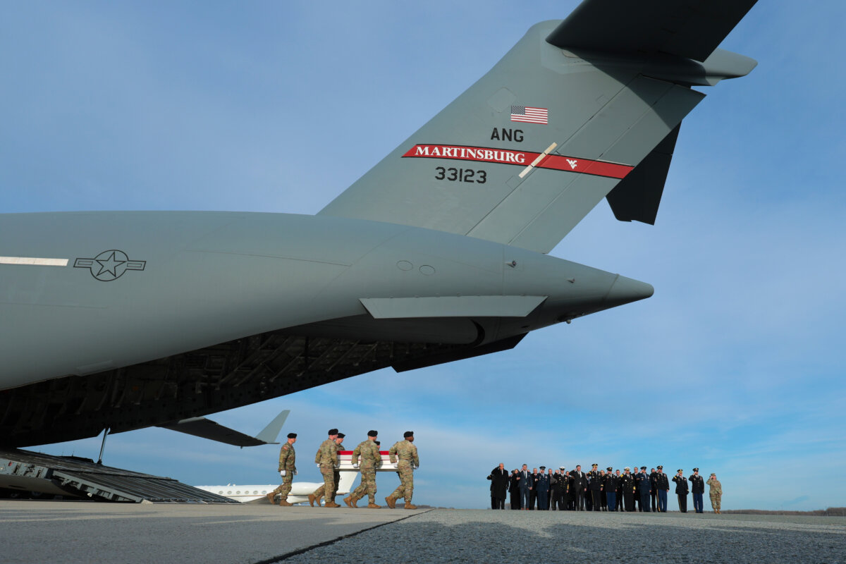 A U.S. Army carry team moves a flagged-draped transfer case containing the remains of Iowa National Guardsman Sgt. William Nathaniel Howard at Dover Air Force Base in Dover, Del., on Dec. 17, 2025. Iowa National Guard members Howard and Sgt. Edgar Brian Torres-Tovar, and Ayad Mansoor Sakat, a U.S. civilian working as an interpreter, were killed during an ambush by an Islamic State gunman in Syria. (Anna Moneymaker/Getty Images)