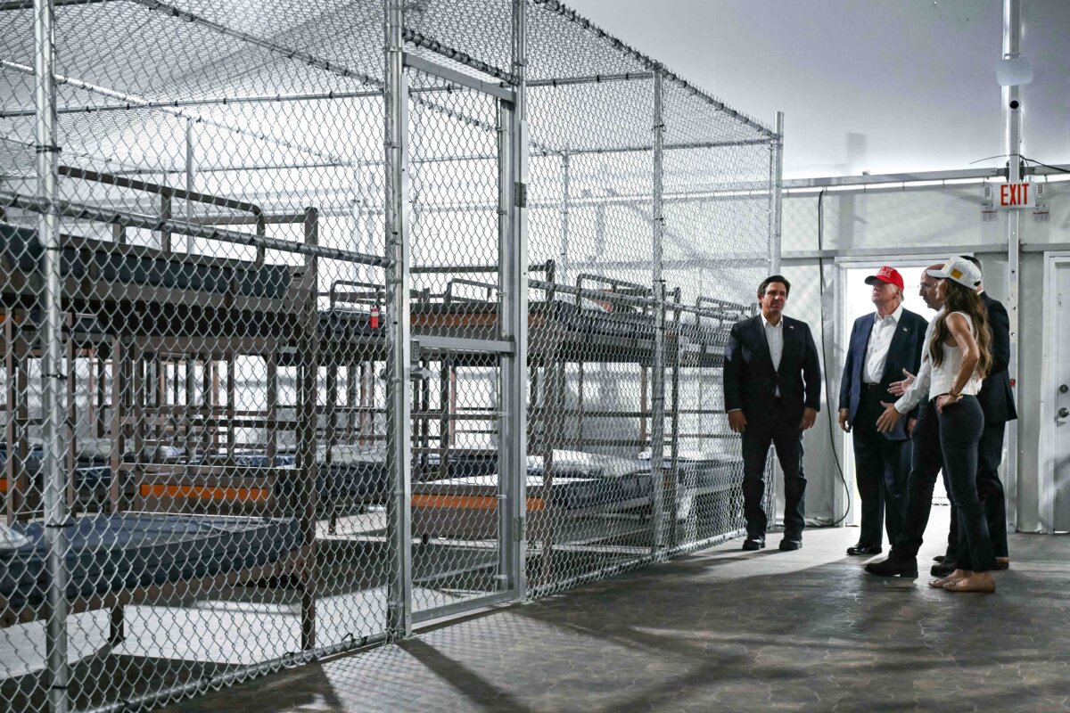President Donald Trump (C), Florida Gov. Ron DeSantis (L), and Secretary of Homeland Security Kristi Noem (R) tour an immigration detention center dubbed Alligator Alcatraz, located in Ochopee, Fla., on July 1, 2025. (Andrew Caballero-Reynolds/AFP via Getty Images)