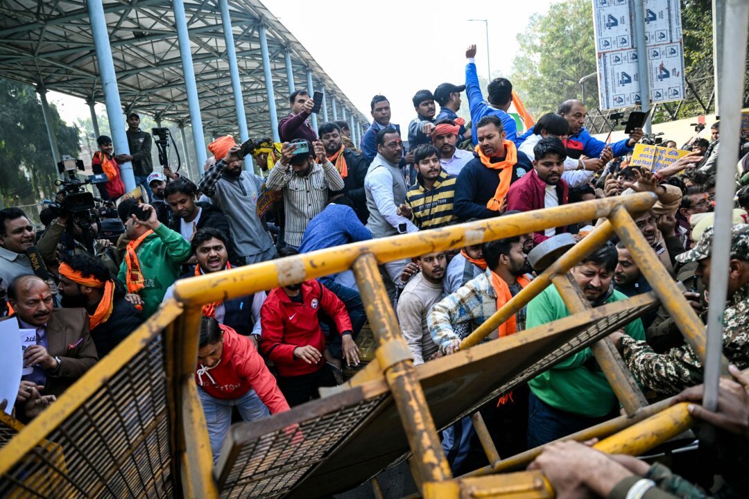 Day in Photos: Protests in India, House Explosion in Paris, and Christmas Ballet in Kenya