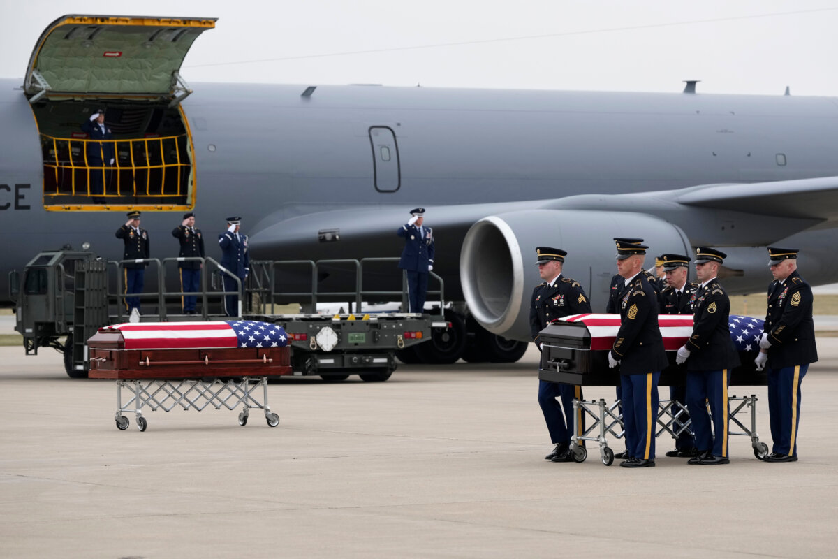 The remains of Staff Sgt. Edgar Brian Torres-Tovar, 25, of Des Moines, Iowa, one of two Iowa National Guard members killed in an attack in the Syrian desert, is moved during a dignified transfer at the Des Moines International Airport in Des Moines, Iowa, on Dec. 24, 2025. (Charlie Neibergall/AP Photo)