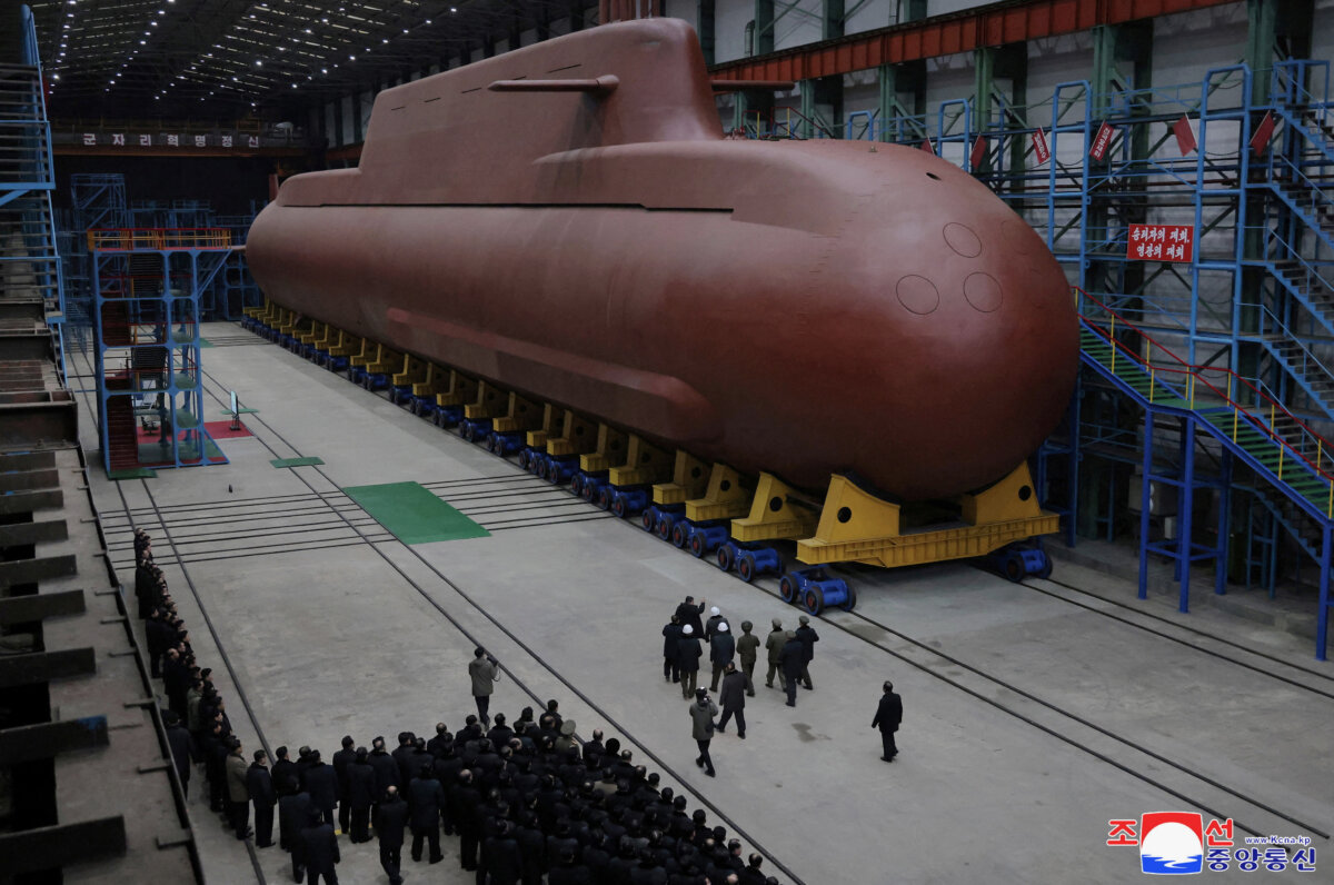 North Korean leader Kim Jong Un visits the construction site of an 8,700-ton nuclear-powered submarine capable of launching surface-to-air missiles in this picture released by North Korea's state-run Korean Central News Agency on Dec. 25, 2025. (KCNA via Reuters)