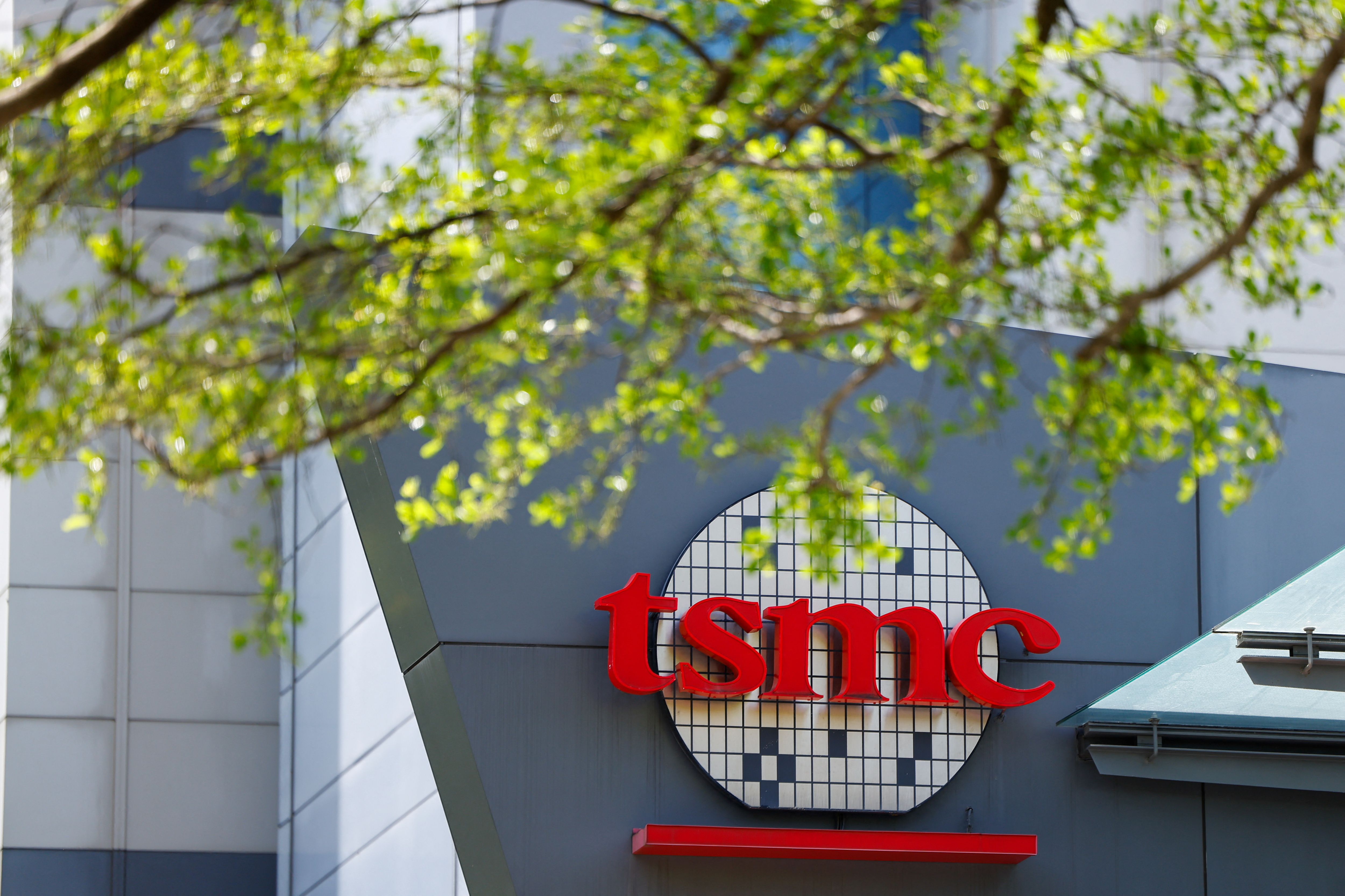 The TSMC logo is displayed on a building in Hsinchu