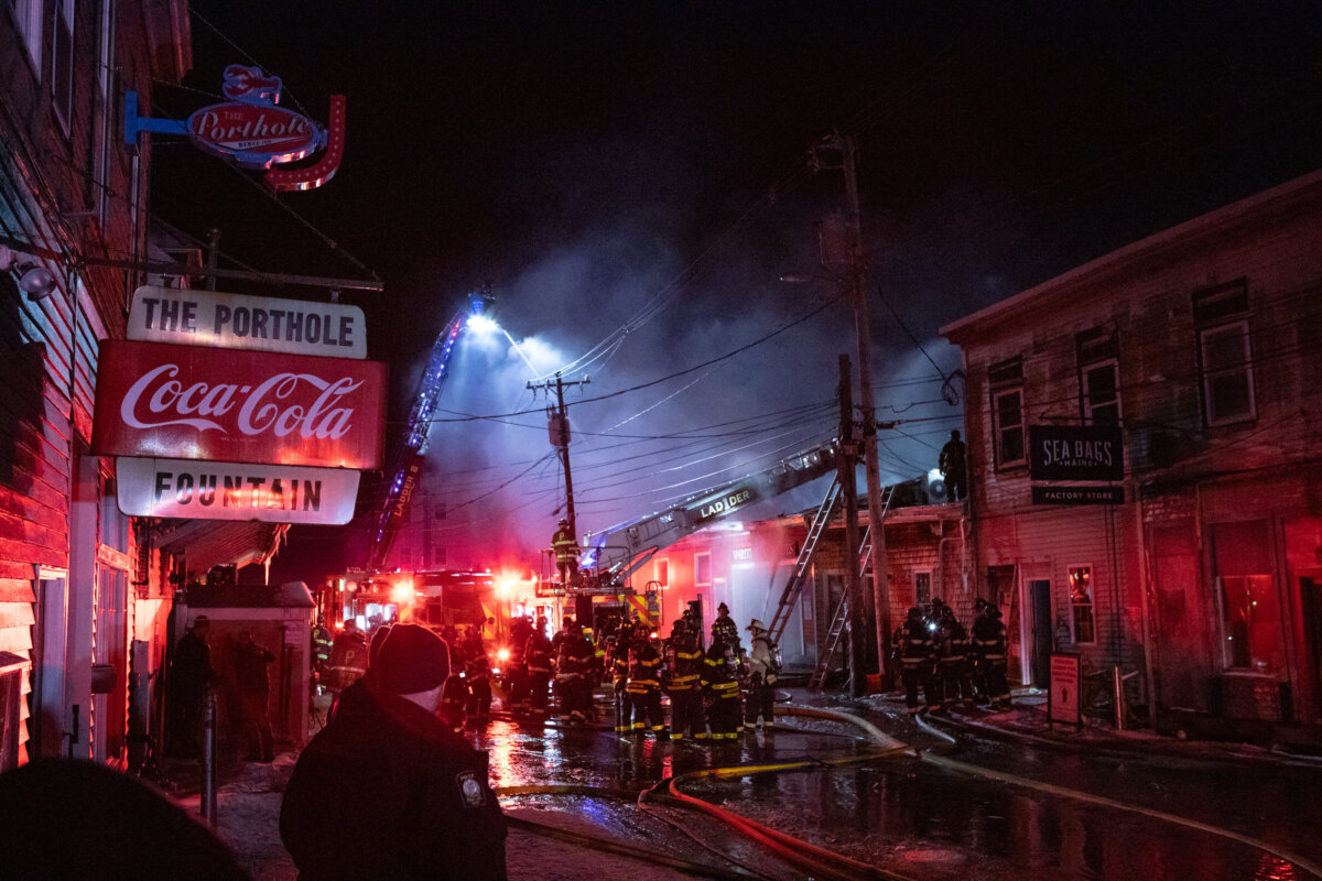 Firefighters battle a three-alarm fire on the historic Old Port waterfront in Portland, Maine, on Dec. 27, 2025. (Libby Kamrowski Kenny/Portland Press Herald via AP)