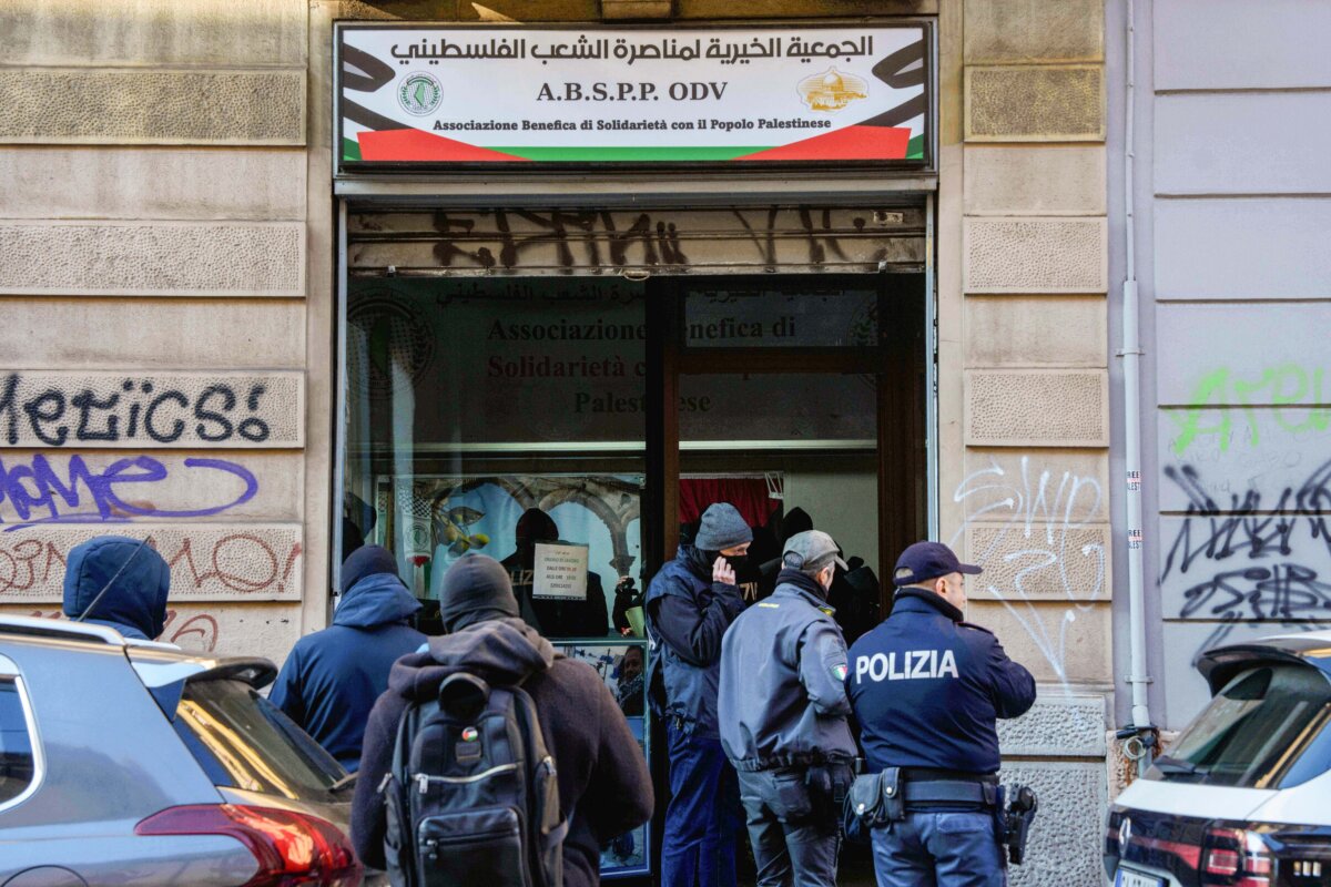 Police officers inspect a charitable association supporting Palestinian civilians in Milan, Italy, on Dec. 27, 2025 after Italian investigators have arrested nine people suspected of raising millions of euros for Hamas. (Claudio Furlan/LaPresse via AP)
