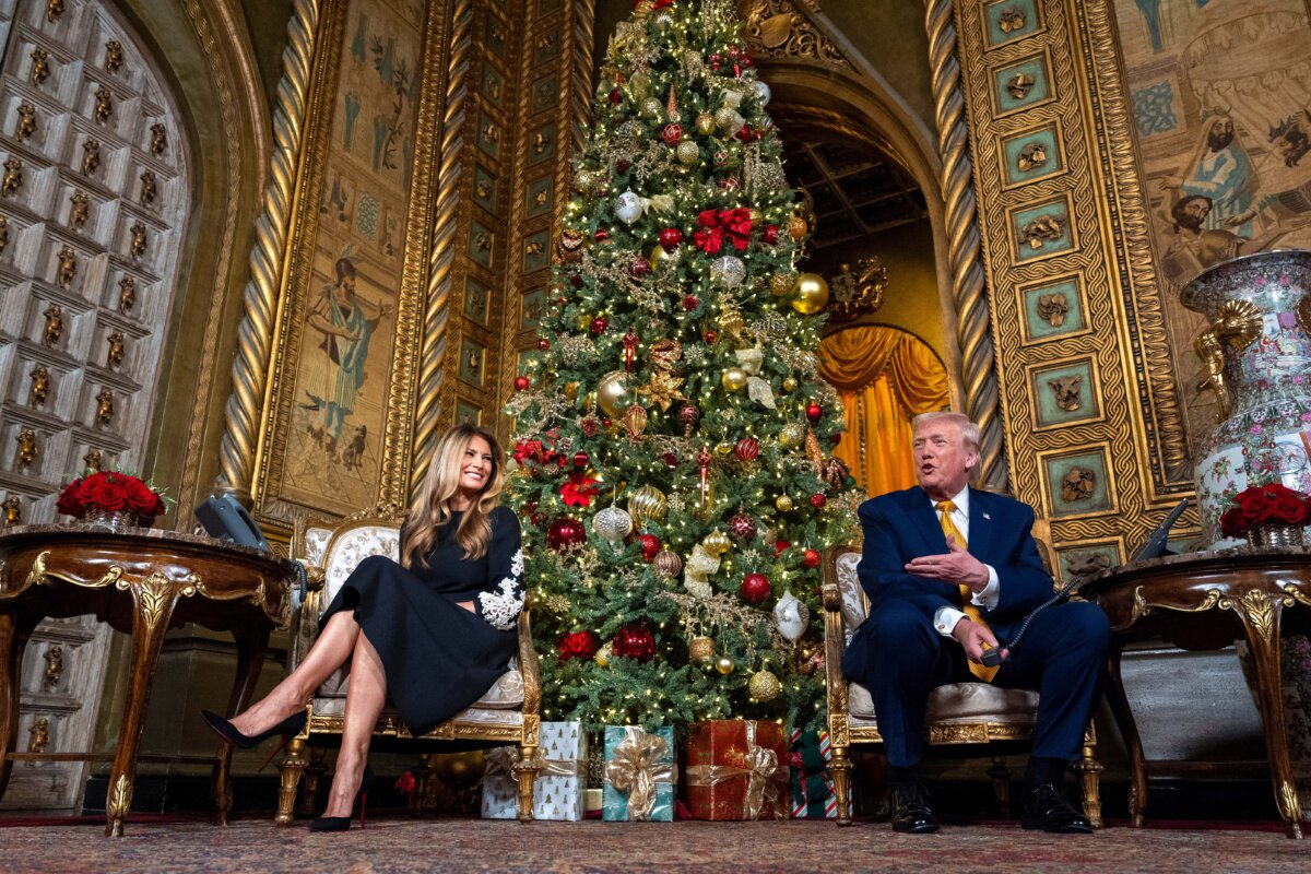 President Donald Trump, accompanied by First Lady Melania Trump, speaks during a North American Aerospace Defense Command Tracks Santa Operation call at his Mar-a-Lago club, in Palm Beach, Fla., on Dec. 24, 2025. (Alex Brandon/AP Photo)