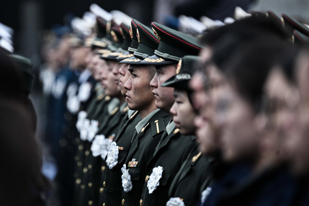 Chinese People's Liberation Army members attend a ceremony to mark China's National Memorial Day for Nanjing Massacre Victims in Nanjing, China, on Dec. 13, 2025. (Hector Retamal/AFP via Getty Images)