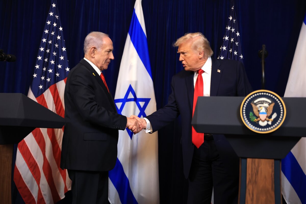 President Donald Trump shakes hands with Israeli Prime Minister Benjamin Netanyahu during a press conference at Trump's Mar-a-Lago club in Palm Beach, Fla., on Dec. 29, 2025. (Joe Raedle/Getty Images)
