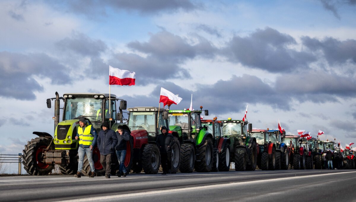 Polish farmers line up their tractors and trucks along the road next to the town of Wiskitki, on Dec. 30, 2025, as they protest against the upcoming signing of a trade agreement between the European Union and the South American bloc Mercosur. The EU-Mercosur pact would create the world's biggest free-trade area and help EU members export more vehicles, machinery, wines, and spirits to Latin America. (Wojtek Radwanski/AFP via Getty Images)