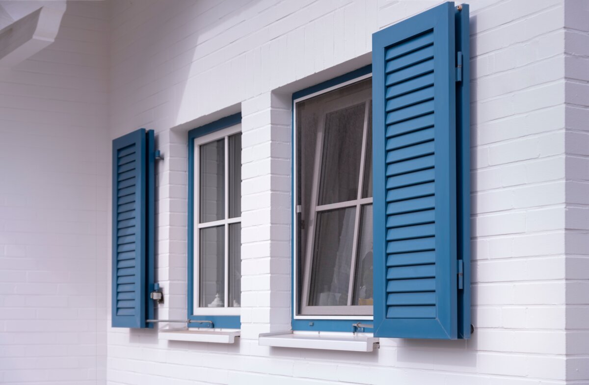 For most people on a limited budget, buying louvered shutter made from unfinished pine at your home center or lumberyard is your most reasonable option. (Gordine N/Shutterstock)