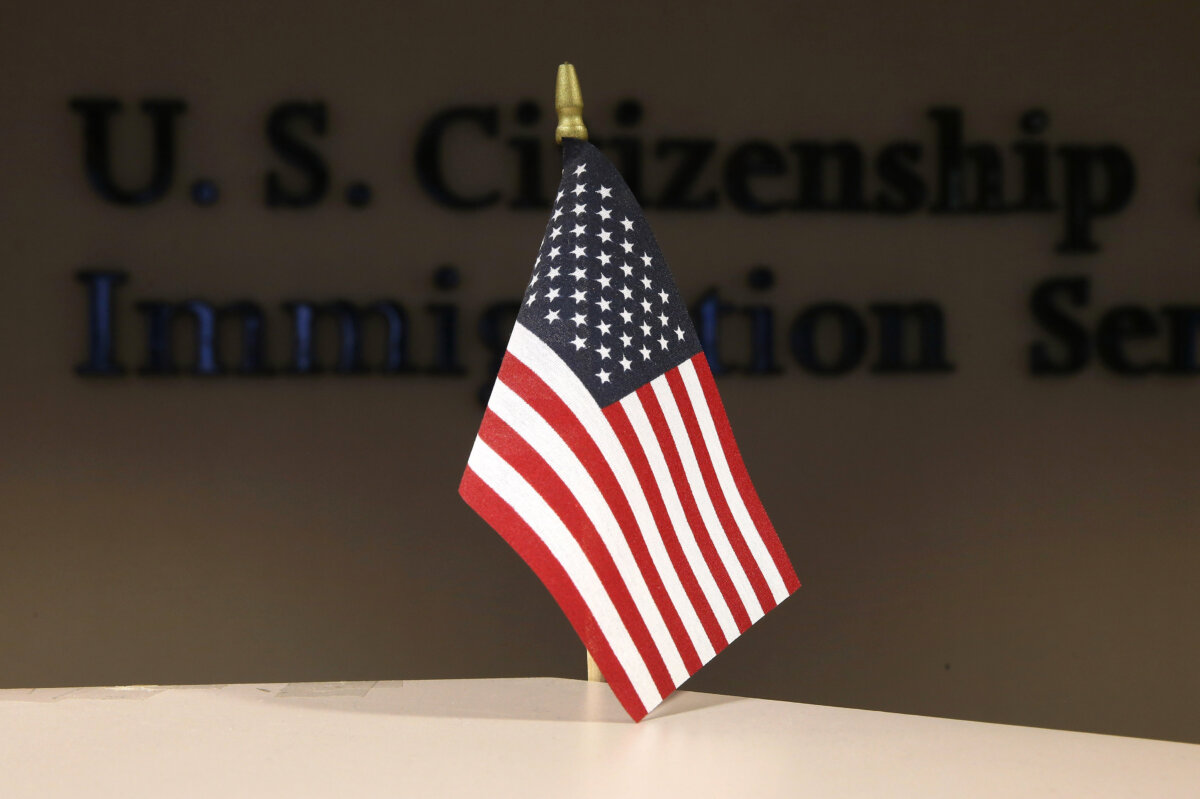 A U.S. flag greets immigrants ahead of a naturalization ceremony in New York City on Aug. 16, 2013. (John Moore/Getty Images)