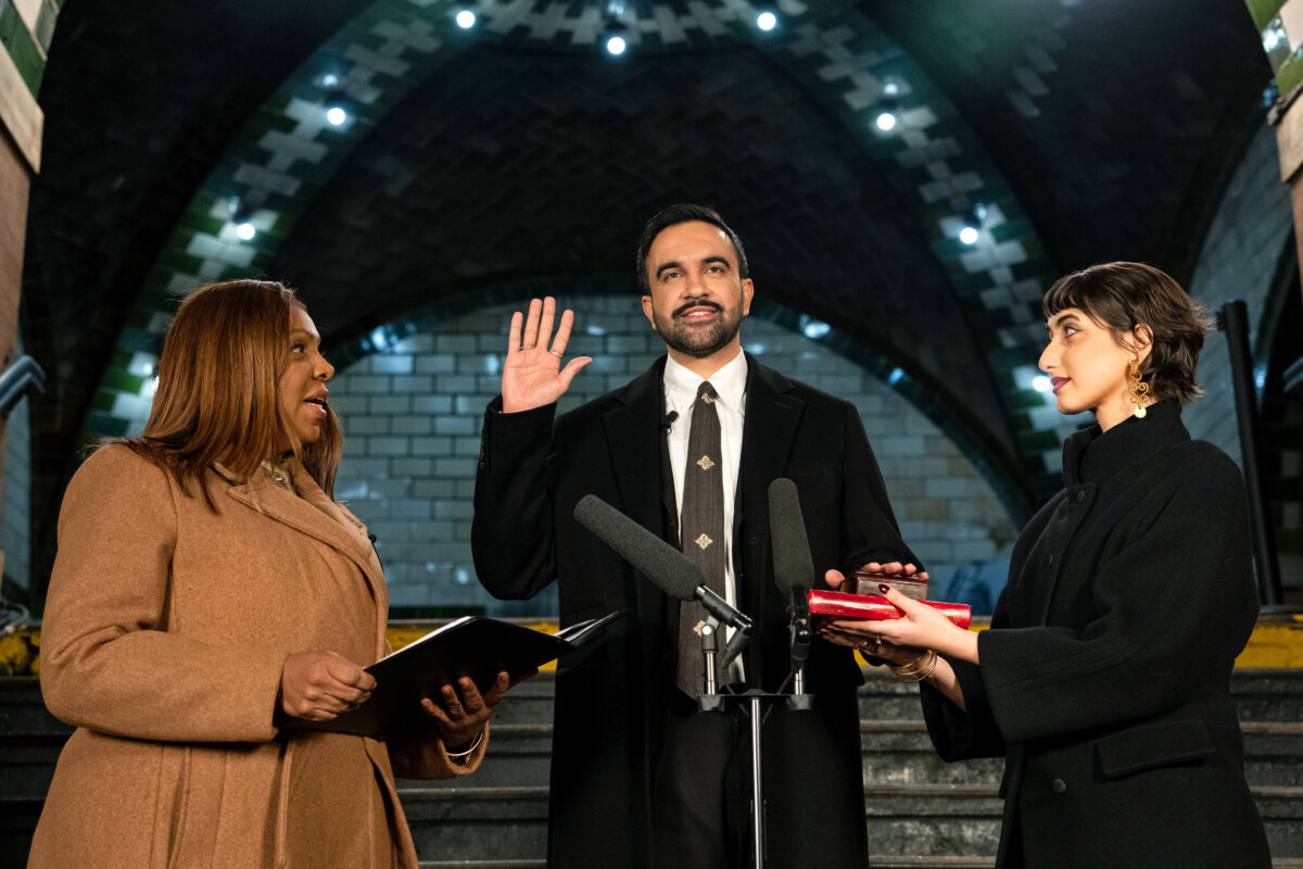 Zohran Mamdani is sworn in as New York City's 112th mayor by New York Attorney General Letitia James (L), alongside his wife Rama Duwaji (R), at the former City Hall subway station in New York City on Jan. 1, 2026. (Amir Hamja-Pool/Getty Images)