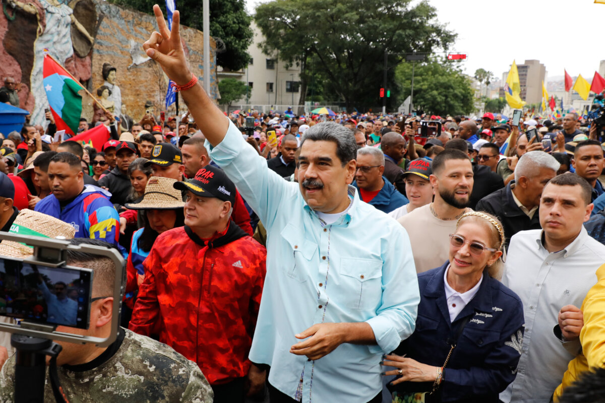 Venezuelan President Nicolas Maduro joins a rally marking the anniversary of the Battle of Santa Ines, which took place during Venezuela's 19th-century Federal War, in Caracas, Venezuela, on Dec. 10, 2025. (Cristian Hernandez /AP Photo)