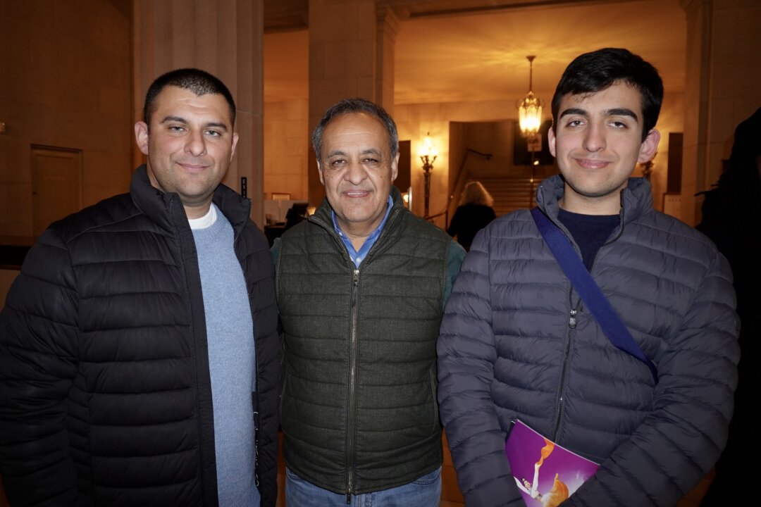 Wahid Khugiani (C) and his family enjoyed Shen Yun's evening performance at the War Memorial Opera House on Jan. 2, 2026. (Lily Yu/The Epoch Times)