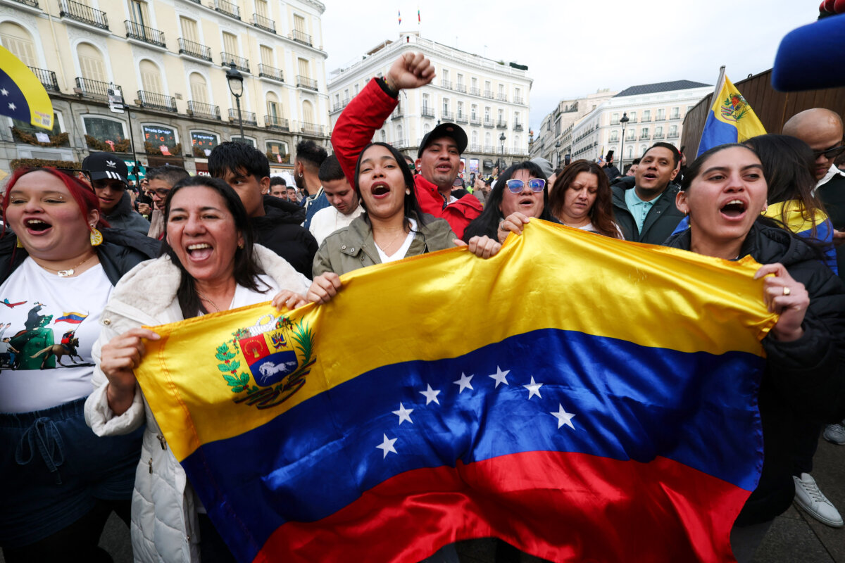 Venezuelan citizens living in Spain celebrate at Puerta del Sol square in Madrid on Jan. 3, 2026, after U.S. forces captured Venezuelan leader Nicolás Maduro following a strike on Venezuela. (Pierre-Philippe Marcou/AFP via Getty Images)