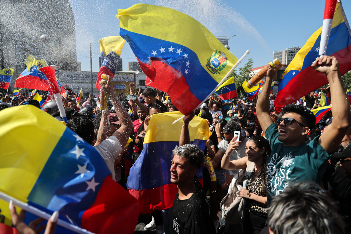 Venezuelans living in Chile celebrate in Santiago on Jan. 3, 2026, after U.S. forces captured Venezuelan leader Nicolás Maduro. (Javier Torres / AFP via Getty Images)