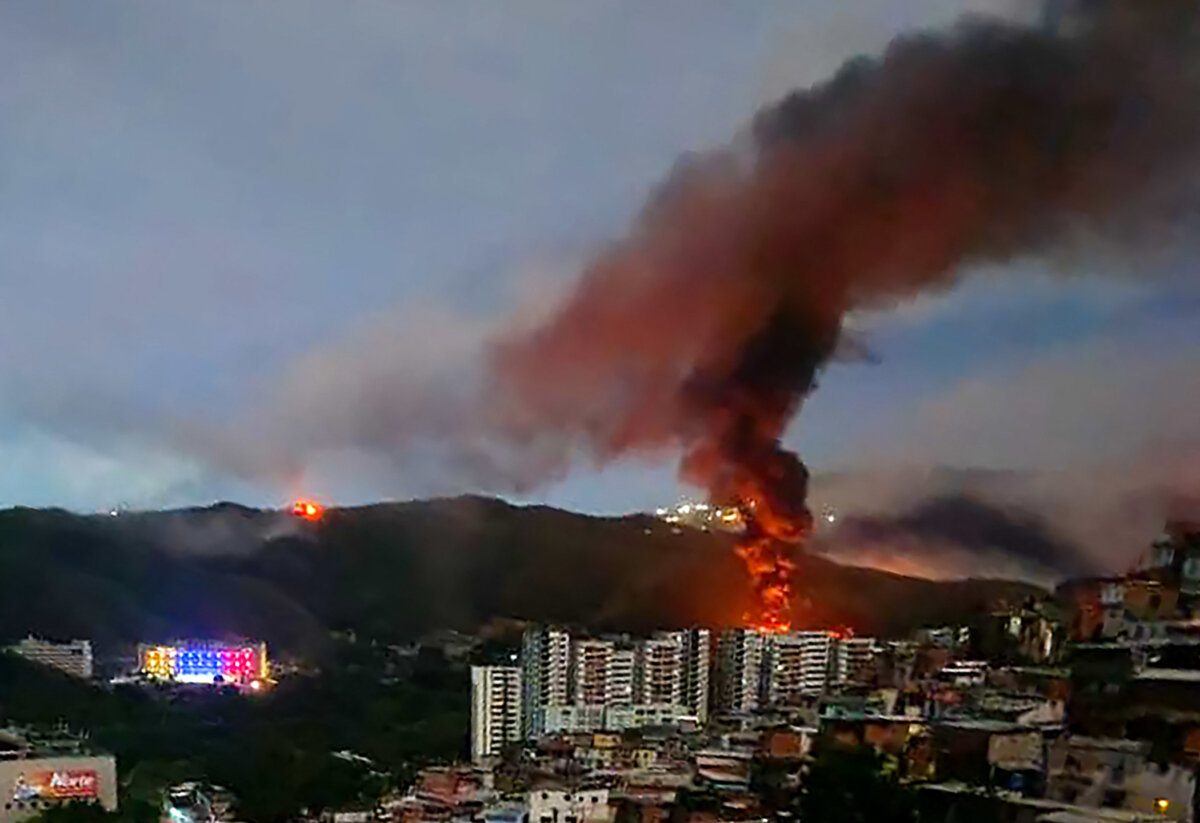 A fire burns at Fuerte Tiuna, Venezuela's largest military complex in Caracas, after a U.S. military assault on Jan. 3, 2026. (AFP via Getty Images)