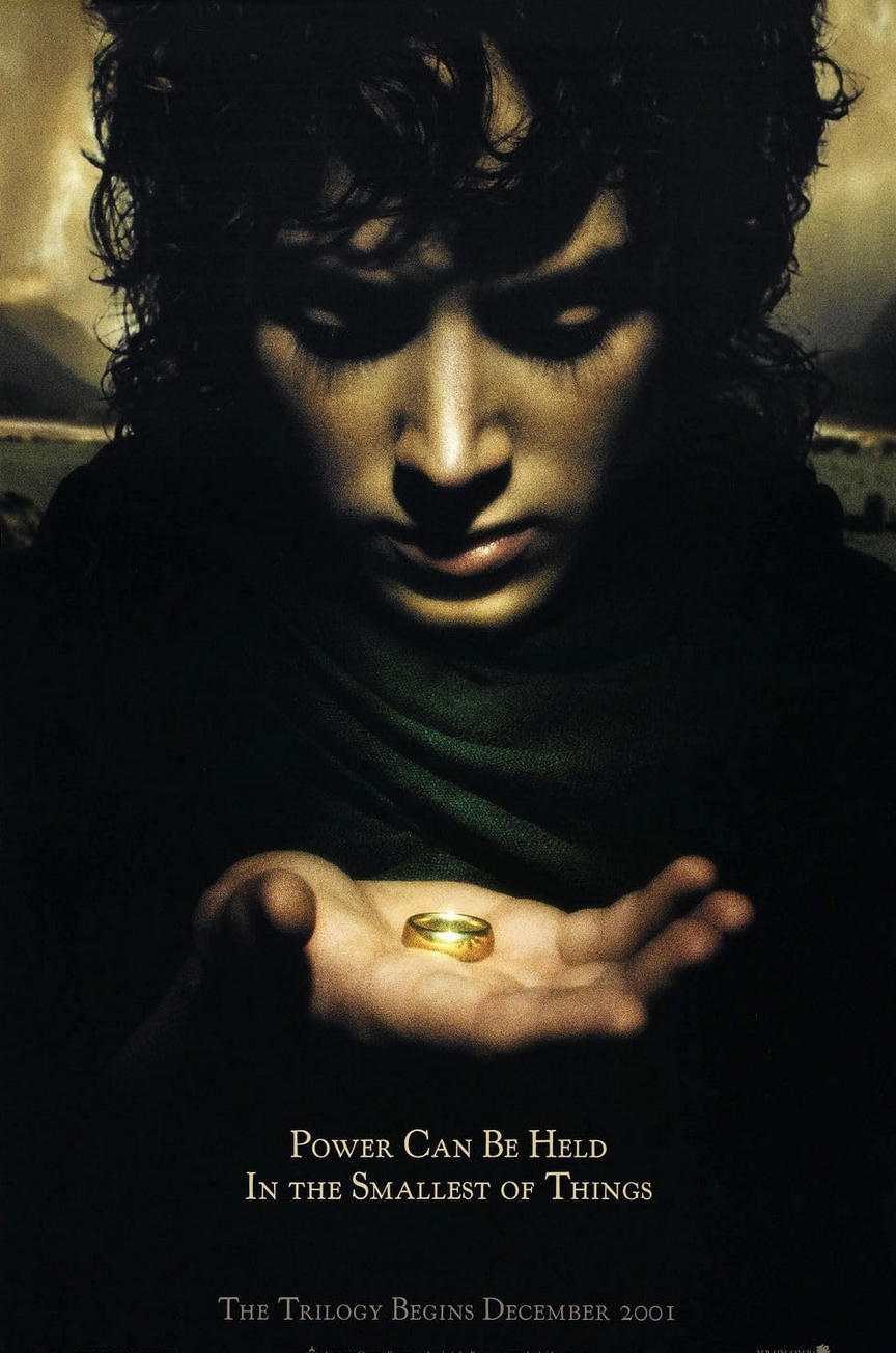 Hobbit holds ring in The Lord of the Rings: The Fellowship of the Ring