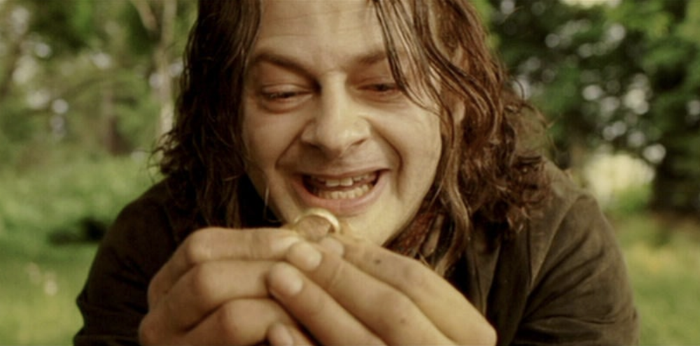 hobbit holds ring in The Lord of the Rings: The Fellowship of the Ring