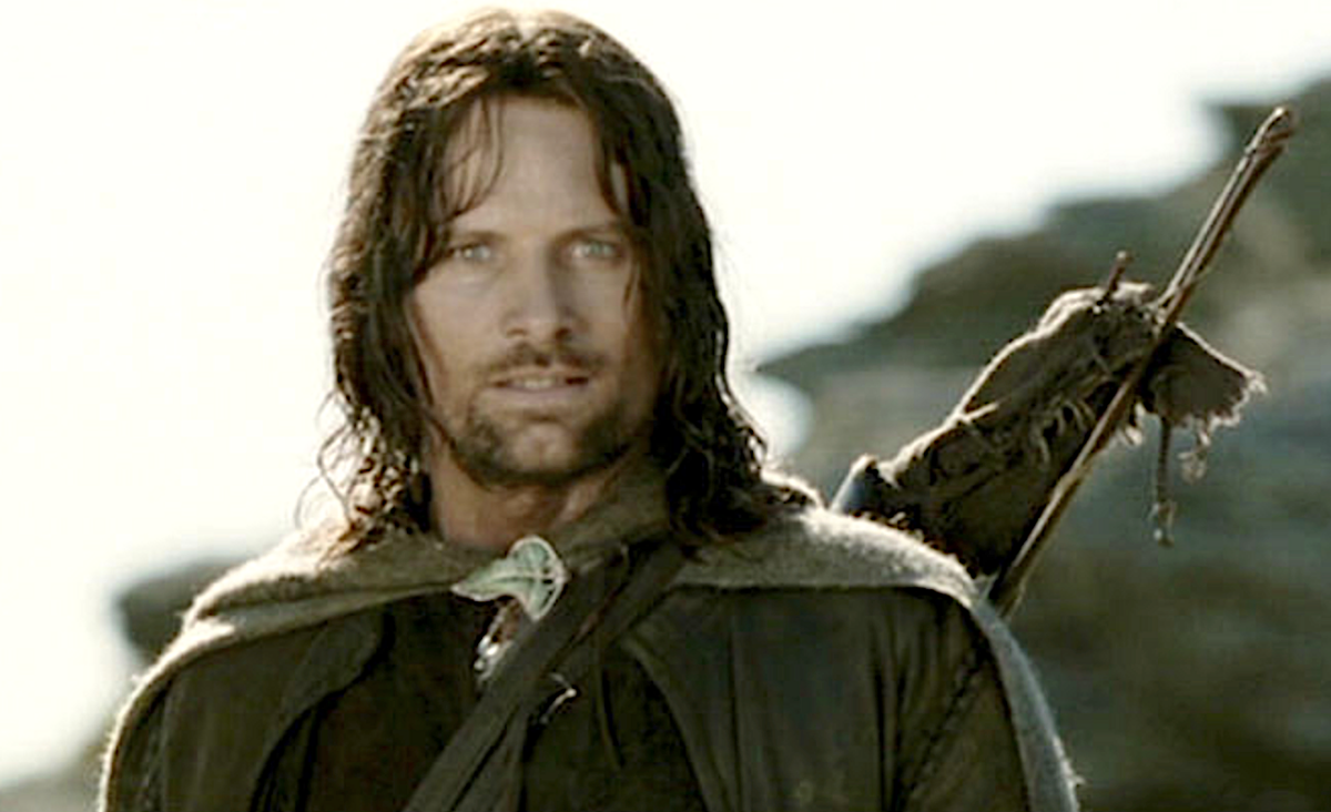 man with cape and sword in The Lord of the Rings: The Fellowship of the Ring
