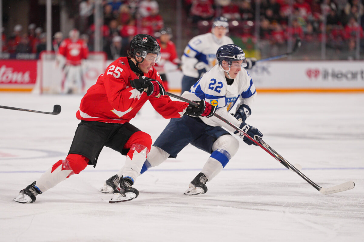 Caleb Desnoyers of Team Canada and Emil Hemming of Finland skate after the puck in the first period of a Group B stage game during the 2026 IIHF World Junior Championship at Mariucci Arena in Minneapolis, Minnesota, on Dec. 31, 2025 . (Brad Rempel/Getty Images)