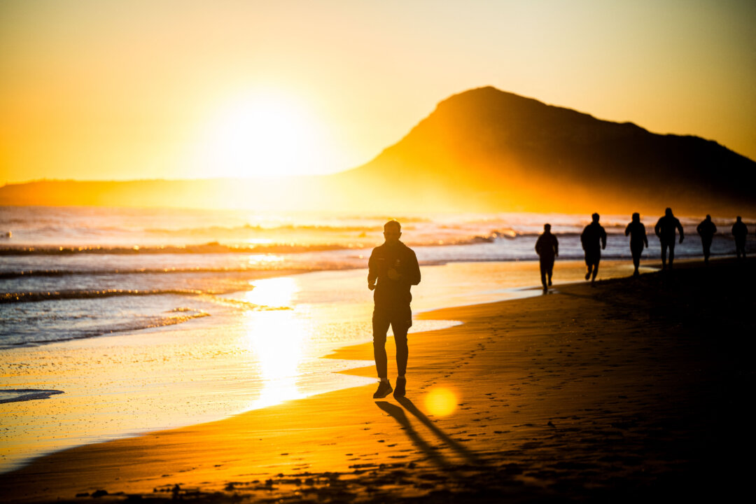 People take part in a morning run in Oliva, Spain, on Jan. 7, 2026. (Jasper Jacobs/AFP via Getty Images)