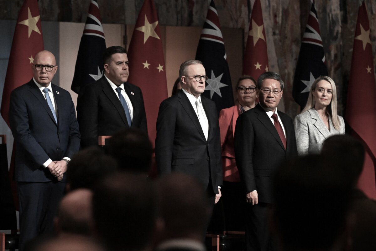 China's Premier Li Qiang (2nd R), Australia's Prime Minister Anthony Albanese (C), Opposition Leader Peter Dutton (L) and Speaker of the House of Representatives Milton Dick (2nd L) pose for pictures during an official lunch at the Australian Parliament House in Canberra on June 17, 2024. (Lukas Coch/ POOL/AFP via Getty Images)